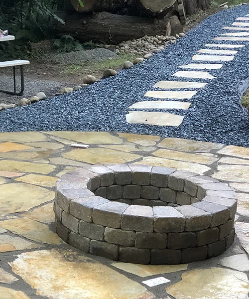 Flastone wet small block wall and fire pit In Kent